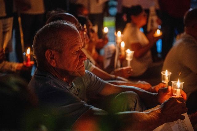 Relatives of political prisoner Juan Pablo Guanipa take part in a vigil in front of Plaza La Republica in Maracaibo, Zulia state, Venezuela, on February 1, 2026. Venezuela's acting president announced on January 30 a proposal for mass amnesty in the country, in her latest major reform since the US toppling of Nicolas Maduro just weeks ago. (Photo by Maryorin Mendez / AFP)