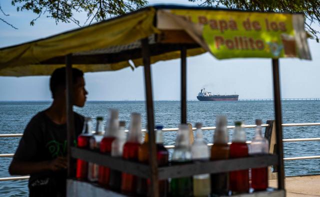 This view shows the crude oil tanker Blasa from Panama on Lake Maracaibo in Maracaibo, Venezuela on February 1, 2026. Venezuelan interim President Delcy Rodriguez of oil-rich Venezuela said on January 30, 2026, she had agreed on energy cooperation with India, a day after Caracas opened its hydrocarbons sector to private companies. (Photo by Maryorin Mendez / AFP)