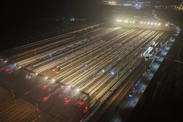 High-speed trains are seen at a train station on the first day of the annual Chunyun Spring Festival travel period,  in Nanjing, in China’s eastern Jiangsu province on February 2, 2026. (Photo by AFP) / China OUT