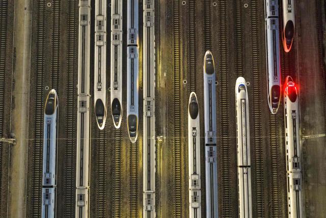 High-speed trains are seen at a train station on the first day of the annual Chunyun Spring Festival travel period,  in Nanjing, in China’s eastern Jiangsu province on February 2, 2026. (Photo by AFP) / China OUT