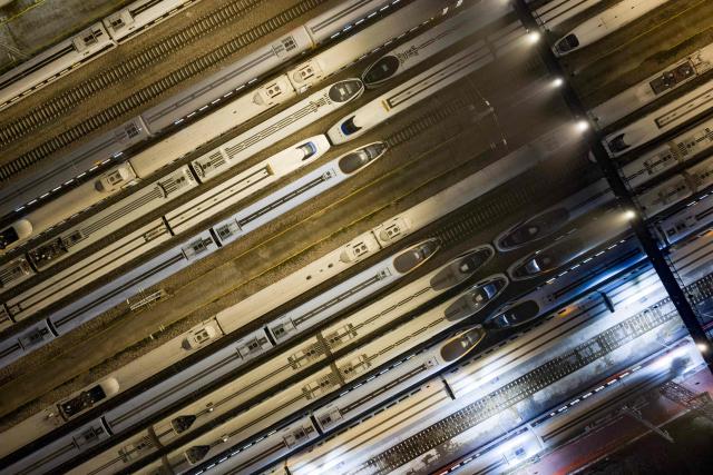 High-speed trains are seen at a train station on the first day of the annual Chunyun Spring Festival travel period,  in Nanjing, in China’s eastern Jiangsu province on February 2, 2026. (Photo by AFP) / China OUT