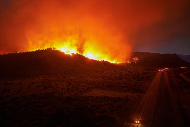 This aerial view shows a forest fire burning in the mountains of the rural area of Epuyén, in the Patagonian region of Chubut province, Argentina, on February 1, 2026. Argentina's government on Thursday declared an emergency in Patagonia, where wildfires have ripped through vast tracts of forest since the start of the Southern Hemisphere summer. (Photo by Gonzalo KEOGAN / AFP)