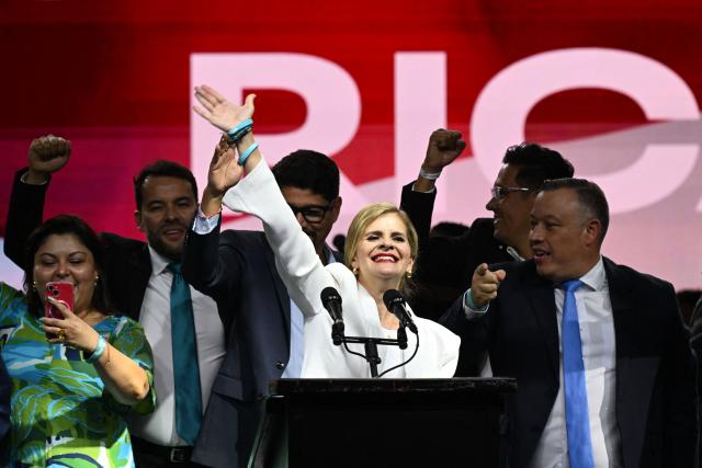 Costa Rica’s presidential candidate from the Sovereign People Party, Laura Fernandez, waves to supporters during her victory speech after the presidential election results at the Aurola Hotel, in San Jose on February 1, 2026. Right-wing candidate Laura Fernandez won Costa Rica's presidential election on February 1 by a landslide after promising to crack down hard on rising violence linked to the cocaine trade. (Photo by MARVIN RECINOS / AFP)