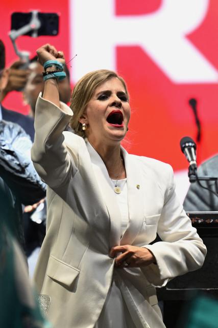 Costa Rica’s presidential candidate from the Sovereign People Party, Laura Fernandez, gestures to supporters during her victory speech after the presidential election results at the Aurola Hotel, in San Jose on February 1, 2026. Right-wing candidate Laura Fernandez won Costa Rica's presidential election on February 1 by a landslide after promising to crack down hard on rising violence linked to the cocaine trade. (Photo by MARVIN RECINOS / AFP)