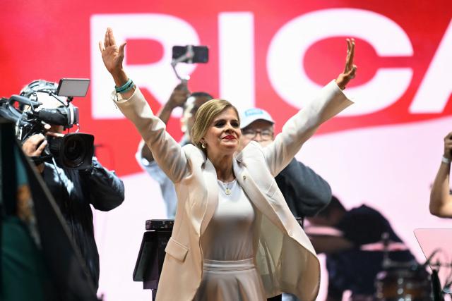 Costa Rica’s presidential candidate from the Sovereign People Party, Laura Fernandez, waves to supporters during her victory speech after the presidential election results at the Aurola Hotel, in San Jose on February 1, 2026. Right-wing candidate Laura Fernandez won Costa Rica's presidential election on February 1 by a landslide after promising to crack down hard on rising violence linked to the cocaine trade. (Photo by MARVIN RECINOS / AFP)