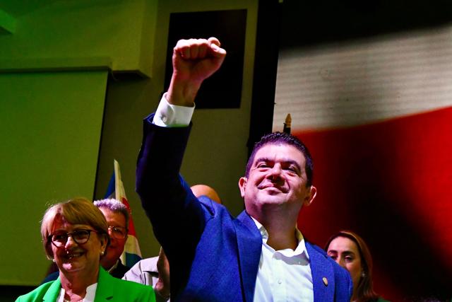 Costa Rica’s presidential candidate from the Liberation Party, Alvaro Ramos, gestures to supporters during his concession speech after the presidential election results at the Crowne Plaza Corobici hotel in San Jose on February 1, 2026. Right-wing law-and-order candidate Laura Fernandez enjoyed a commanding lead in the country's presidential election, according to partial results from the February 1 vote, which was dominated by concern over drug-related crime. (Photo by EZEQUIEL BECERRA / AFP)