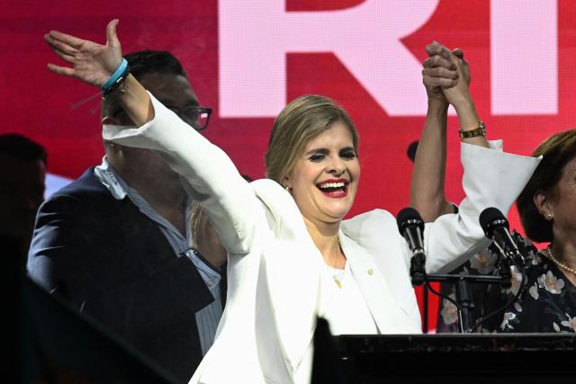 Costa Rica’s presidential candidate from the Sovereign People Party, Laura Fernandez, waves to supporters during her victory speech after the presidential election results at the Aurola Hotel, in San Jose on February 1, 2026. Right-wing candidate Laura Fernandez won Costa Rica's presidential election on February 1 by a landslide after promising to crack down hard on rising violence linked to the cocaine trade. (Photo by MARVIN RECINOS / AFP)