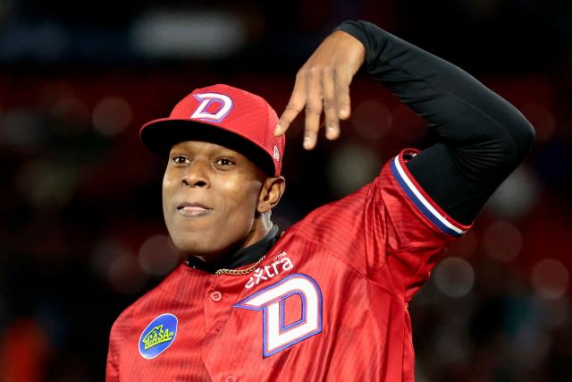 Dominican Republic's #40 Jefry Yan celebrates at the end of the eighth inning of the Caribbean Series baseball tournament second game between Dominican Republic's Leones del Escogido and Mexico's Charros de Jalisco at the Panamerican Stadium in Jalisco, Mexico, on February 1, 2026. (Photo by Ulises Ruiz / AFP)