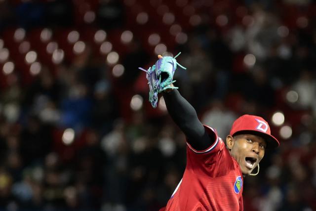 Dominican Republic's #40 Jefry Yan celebrates at the end of the eighth inning of the Caribbean Series baseball tournament second game between Dominican Republic's Leones del Escogido and Mexico's Charros de Jalisco at the Panamerican Stadium in Jalisco, Mexico, on February 1, 2026. (Photo by Ulises Ruiz / AFP)