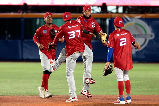 Dominican Republic's players celebrate at the end of the ninth inning of the Caribbean Series baseball tournament second game between Dominican Republic's Leones del Escogido and Mexico's Charros de Jalisco at the Panamerican Stadium in Jalisco, Mexico, on February 1, 2026. (Photo by Ulises Ruiz / AFP)