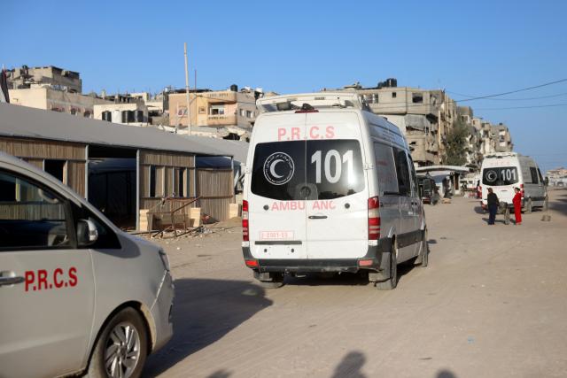 Ambulances transporting Palestinian patients and war-wounded, head towards the Kerem Shalom crossing to leave the Gaza Strip for treatment abroad, in Khan Yunis in the southern Gaza Strip, on February 2, 2026. Israeli state broadcaster Kan reported that around 150 people were expected to leave Gaza for Egypt on February 2, including 50 patients. The report said around 50 people were also expected to enter the territory. The entity overseeing patient transfer procedures is the World health Organisation (WHO). (Photo by Bashar Taleb / AFP)