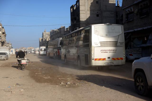 Buses carrying Palestinian patients and war-wounded, are escorted as they head towards Kerem Shalom crossing to leave the Gaza Strip for treatment abroad, in Khan Yunis in the southern Gaza Strip, on February 2, 2026. The entity overseeing patient transfer procedures is the World health Organisation (WHO). (Photo by Bashar Taleb / AFP)