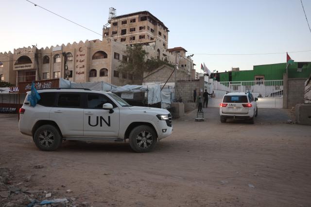 World Health Organisation vehicles leave the Red Crescent center as Palestinian patients and war-wounded, are escorted towards the Kerem Shalom crossing to leave the Gaza Strip for treatment abroad, in Khan Yunis in the southern Gaza Strip, on February 2, 2026. Israeli state broadcaster Kan reported that around 150 people were expected to leave Gaza for Egypt on February 2, including 50 patients. The report said around 50 people were also expected to enter the territory. (Photo by Bashar Taleb / AFP)