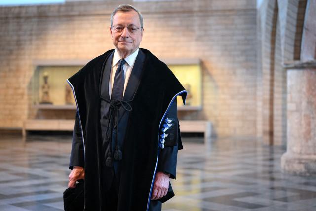 Italy's former Prime Minister and former European Central Bank (ECB) president Mario Draghi poses during the Patron saint's day celebrations with the procession of the togati and the ceremonial awarding of six honorary doctorates at KU Leuven, in Leuven on February 2, 2026. (Photo by ELIAS ROM / Belga / AFP) / Belgium OUT