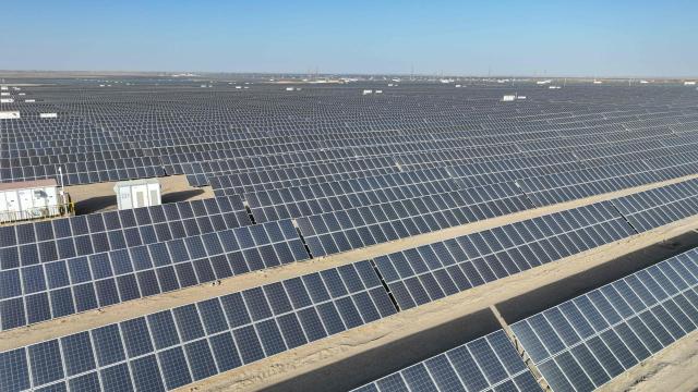 Rows of photovoltaic solar panels are seen at the Hongliuwa Photovoltaic Industrial Park in Jinta County in the Gobi Desert, in China's northwestern Gansu province on on February 1, 2026. (Photo by AFP) / China OUT