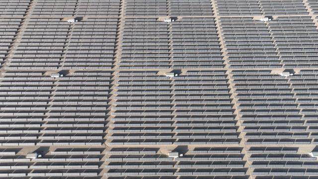 Rows of photovoltaic solar panels are seen at the Hongliuwa Photovoltaic Industrial Park in Jinta County in the Gobi Desert, in China's northwestern Gansu province on on February 1, 2026. (Photo by AFP) / China OUT