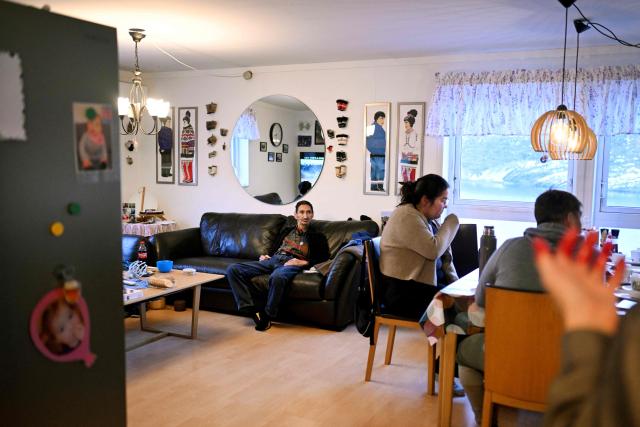 The family of teacher Camilla Olsen watches football at their home at the settlement Sarfannguit, near Sisimiut, Greenland on February 1, 2026. Sarfannguit is a settlement in central-western Greenland, is located within the Aasivissuit  Nipisat UNESCO World Heritage Site, and was inscribed on the World Heritage List in 2018 for its outstanding archeological sites representing the human occupation of Greenland for over 4,000 years. Currently, approximately 50 residents live there.

Search for all these reportage images using: GREENLAND - DENMARK - HUNTING - SEALING. (Photo by Ina FASSBENDER / AFP)