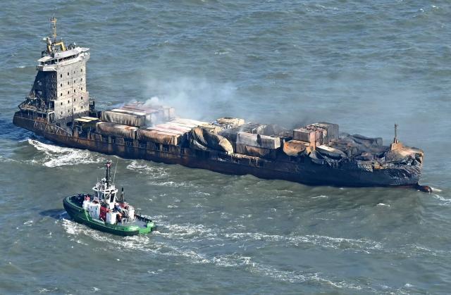 (FILES) Smoke rises from the MV Solong cargo ship in the North Sea, off the coast of Withernsea, east of England, on March 11, 2025, after it collided with the MV Stena Immaculate tanker on March 10. The Russian captain of the MV Solong cargo ship that hit an anchored oil tanker in the North Sea in 2025 was on February 2, 2026 found guilty by a UK court of killing a crew member. After eight hours of deliberation, the jury convicted Vladimir Motin of the manslaughter of Filipino sailor Mark Angelo Pernia, 38. (Photo by Paul ELLIS / AFP)