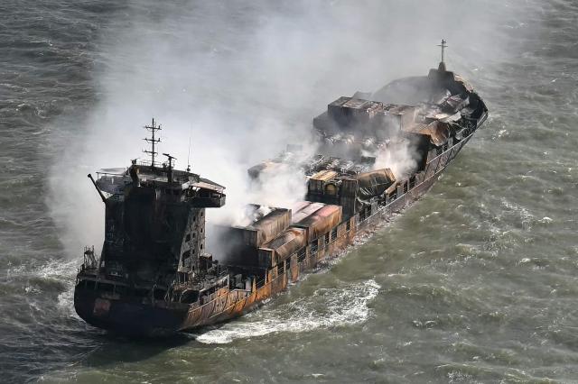 (FILES) Smoke rises from the MV Solong cargo ship in the North Sea, off the coast of Withernsea, east of England, on March 11, 2025, after it collided with the MV Stena Immaculate tanker on March 10. The Russian captain of the MV Solong cargo ship that hit an anchored oil tanker in the North Sea in 2025 was on February 2, 2026 found guilty by a UK court of killing a crew member. After eight hours of deliberation, the jury convicted Vladimir Motin of the manslaughter of Filipino sailor Mark Angelo Pernia, 38. (Photo by Paul ELLIS / AFP)