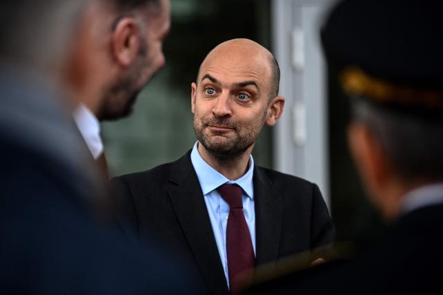France's Minister for Europe and Foreign Affairs Jean-Noel Barrot listens to the staff during a visit to the Fonroche Lighting solar lighting company in Sainte-Colombe-en-Bruilhois, south-western France on February 2, 2026. (Photo by Christophe ARCHAMBAULT / AFP)