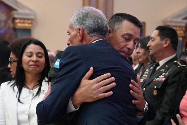 Honduran President Nasry Asfura embraces the Chief of the Joint Staff, Hector Valerio, during a mass offered by the Armed Forces on the 279th anniversary of the Suyapa Virgin, the patron saint of Honduras, at the Suyapa Basilica in Tegucigalpa, on February 2, 2026.  (Photo by Orlando SIERRA / AFP)