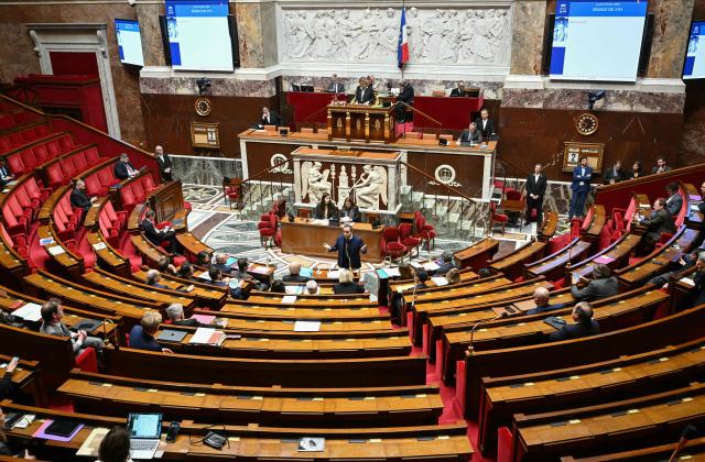 France's Prime Minister Sebastien Lecornu (C) gestures as he speaks during a debate on no-confidence motions against the 2026 finance bill, which was adopted without a vote after the government triggered Article 49.3 of the Constitution, at the National Assembly in Paris on February 2, 2026. (Photo by Bertrand GUAY / AFP)