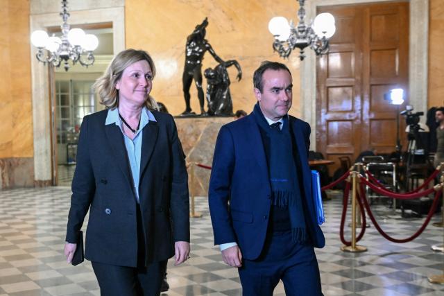 President of the French National Assembly Yael Braun-Pivet (L) and France's Prime Minister Sebastien Lecornu arrive to attend the vote on no-confidence motions against the 2026 finance bill, which was adopted without a vote after the government triggered Article 49.3 of the Constitution, at the National Assembly in Paris on February 2, 2026. (Photo by Bertrand GUAY / AFP)