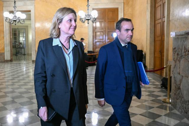 President of the French National Assembly Yael Braun-Pivet (L) and France's Prime Minister Sebastien Lecornu arrive to attend the vote on no-confidence motions against the 2026 finance bill, which was adopted without a vote after the government triggered Article 49.3 of the Constitution, at the National Assembly in Paris on February 2, 2026. (Photo by Bertrand GUAY / AFP)