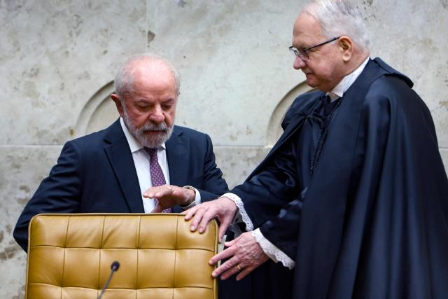 Brazil's President Luiz Inacio Lula da Silva (L) and Brazil's Chief Justice Edson Fachin attend the opening ceremony of the judicial year at the Supreme Court in Brasilia on February 2, 2026. (Photo by Sergio Lima / AFP)