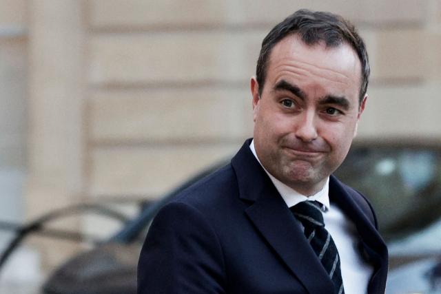 (FILES) France's Prime Minister Sebastien Lecornu leaves after the cabinet meeting in Paris on January 19, 2026. France adopted a 2026 budget after lawmakers rejected two more no-confidence motions triggered by Prime Minister Sebastien Lecornu's decision to ram the bill through parliament without a vote. (Photo by STEPHANE DE SAKUTIN / AFP)