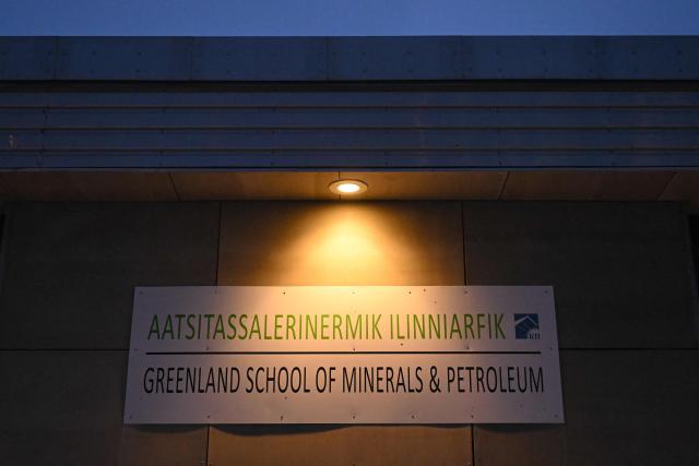 A photo shows a sign reading 'Greenland School of Minerals and Petroleum' in Sisimiut, Greenland on February 2, 2026. (Photo by Ina FASSBENDER / AFP)