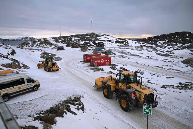 Students practice driving a shovel excavator on the school grounds of the Greenland School of Minerals and Petroleum in Sisimiut, Greenland on February 2, 2026. The purpose and ambition of Greenland School of Minerals and Petroleum (GSMP) is to ensure a skilled workforce for the Greenlandic mining and construction industries. The school offers students international courses during four years apprenticeship programs "skilled manual miner" and "skilled operator of construction equipment". (Photo by Ina FASSBENDER / AFP)