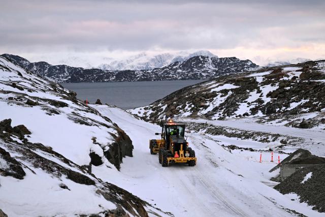 Students practice driving a shovel excavator on the school grounds of the Greenland School of Minerals and Petroleum in Sisimiut, Greenland on February 2, 2026. The purpose and ambition of Greenland School of Minerals and Petroleum (GSMP) is to ensure a skilled workforce for the Greenlandic mining and construction industries. The school offers students international courses during four years apprenticeship programs "skilled manual miner" and "skilled operator of construction equipment". (Photo by Ina FASSBENDER / AFP)