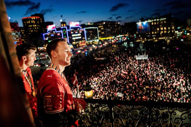 Denmark's men's handball team Emil Jakobsen and Mathias Gidsel celebrate as European champions on the balcony at the Copenhagen City Hall in Copenhagen, Denmark on February 2, 2026, after the team won gold at the Men's EHF Euro 2026 final handball match Denmark vs Germany. (Photo by Sebastian Elias Uth / Ritzau Scanpix / AFP) / Denmark OUT