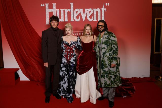 (FROM L) US actor Jacob Elordi, British Actress and filmmaker Emerald Fennell, Australian actress Margot Robbie and British actor Shazad Latif pose during a photocall before the screening of the movie 'Wuthering Heights' at the Grand Rex theater in Paris on February 2, 2026. (Photo by GEOFFROY VAN DER HASSELT / AFP)
