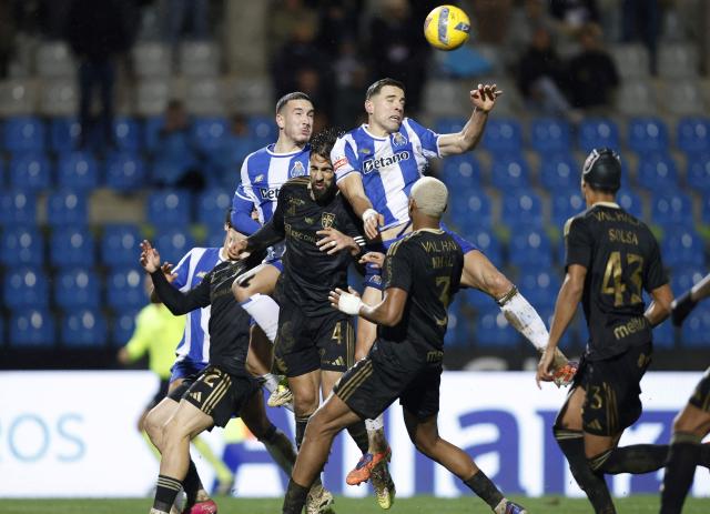 Casa Pia's Portuguese defender #04 Joao Goulart (C), FC Porto's Turkish forward #27 Deniz Gul (L) and FC Porto's Polish defender #05 Jan Bednarek vie for a header during the Portuguese League football match between Casa Pia AC and FC Porto at Rio Maior's municipal stadium, on February 2, 2026. (Photo by FILIPE AMORIM / AFP)
