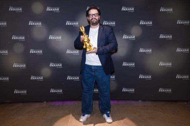 French-Greek Comedian Kostia poses during the second edition of the Auguste de l'Humour awards ceremony for stand-up comedy and humorous performances at the "Nouveau Siecle" venue in Lille, northern France, on February 2, 2026. Elodie Poux was crowned comedian of the year at the second edition of the Auguste de l'humour awards in Lille on February 2, 2026, during a ceremony that sought to honour women after criticism of the overrepresentation of men among the nominees. (Photo by Sameer Al-DOUMY / AFP)