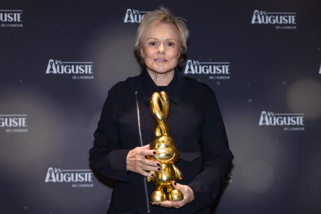 French actress and Honorary Award Recipient, Muriel Robin, poses during the second edition of the Auguste de l'Humour awards ceremony for stand-up comedy and humorous performances at the "Nouveau Siecle" venue in Lille, northern France, on February 2, 2026. Elodie Poux was crowned comedian of the year at the second edition of the Auguste de l'humour awards in Lille on February 2, 2026, during a ceremony that sought to honour women after criticism of the overrepresentation of men among the nominees. (Photo by Sameer Al-DOUMY / AFP)