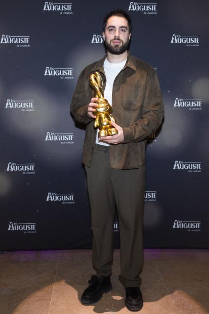French comedian Hugo Pecheur poses during the second edition of the Auguste de l'Humour awards ceremony for stand-up comedy and humorous performances at the "Nouveau Siecle" venue in Lille, northern France, on February 2, 2026. Elodie Poux was crowned comedian of the year at the second edition of the Auguste de l'humour awards in Lille on February 2, 2026, during a ceremony that sought to honour women after criticism of the overrepresentation of men among the nominees. (Photo by Sameer Al-DOUMY / AFP)