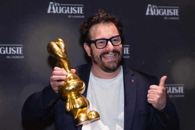 French-Greek Comedian Kostia poses during the second edition of the Auguste de l'Humour awards ceremony for stand-up comedy and humorous performances at the "Nouveau Siecle" venue in Lille, northern France, on February 2, 2026. Elodie Poux was crowned comedian of the year at the second edition of the Auguste de l'humour awards in Lille on February 2, 2026, during a ceremony that sought to honour women after criticism of the overrepresentation of men among the nominees. (Photo by Sameer Al-DOUMY / AFP)