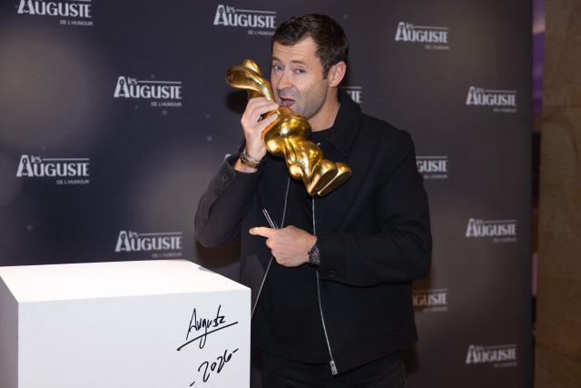 French artist and creator of the trophy, Auguste, poses during the second edition of the Auguste de l'Humour awards ceremony for stand-up comedy and humorous performances at the "Nouveau Siecle" venue in Lille, northern France, on February 2, 2026. Elodie Poux was crowned comedian of the year at the second edition of the Auguste de l'humour awards in Lille on February 2, 2026, during a ceremony that sought to honour women after criticism of the overrepresentation of men among the nominees. (Photo by Sameer Al-DOUMY / AFP)