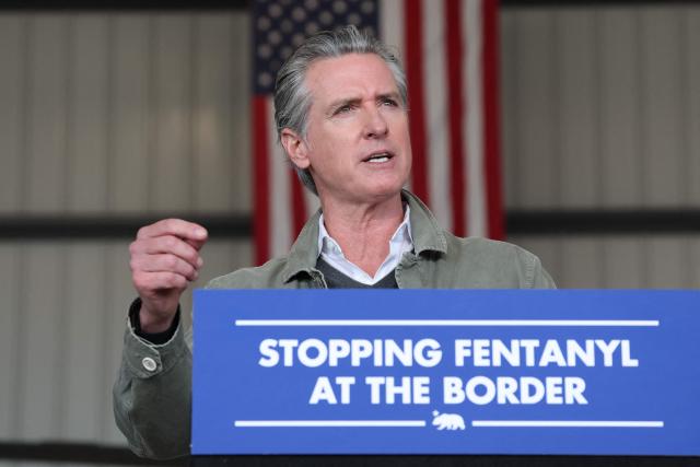 California Governor Gavin Newsom speaks about the California National Guard and California Highway Patrol (CHP) seizures of illicit drugs including fentanyl and border security operations during a press conference at Montgomery-Gibbs Executive Airport in San Diego, California on February 2, 2026. (Photo by Patrick T. Fallon / AFP)