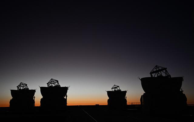 (FILES) General view of the platform of the Very Large Telescope (VLT), with its four optical telescopes and four movable auxiliary telescopes, at the European Southern Observatory's (ESO) Paranal Observatory, on Paranal Hill in Chile's Antofagasta Region, in the Atacama Desert some 1150 km north of Santiago, taken on January 27, 2025. Europe's ESO star-gazing organisation on February 2, 2026 welcomed plans to call off building a massive green energy project in the Chilean desert which threatened to spoil its telescopes' view of the darkest skies on Earth. (Photo by RODRIGO ARANGUA / AFP)