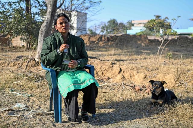 This photograph taken on January 16, 2026 shows AI data labeller Anju Kamari speaking during an interview with AFP in front of her house in Messa village on the outskirts of Ranchi in India's Jharkhand state. India, which will host an international AI summit this month, has ambitious plans. Cities such as Bengaluru, Hyderabad and Chennai host major international players, but India's AI push is also expanding into more remote regions. As AI reaches rural India, it is quietly reshaping lives -- particularly for women from conservative backgrounds. (Photo by Arun SANKAR / AFP) / To go with 'India-AI-Employment-Women', FOCUS