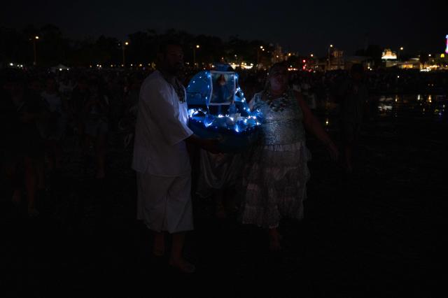 Believers offer tribute to Iemanja, the Goddess of the Sea of the Afro-American religion Umbanda, at Ramirez beach in Montevideo on February 2, 2026. (Photo by Eitan ABRAMOVICH / AFP)
