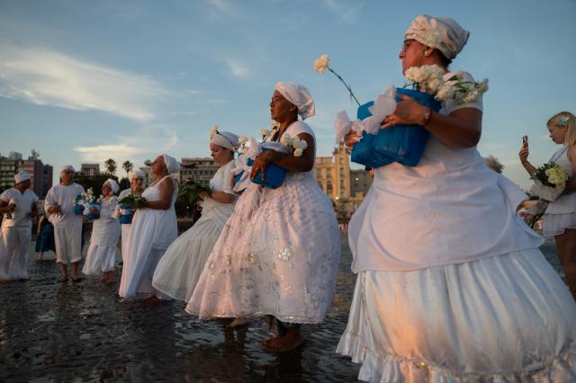 Believers offer tribute to Iemanja, the Goddess of the Sea of the Afro-American religion Umbanda, at Ramirez Beach in Montevideo on February 2, 2026. (Photo by Eitan ABRAMOVICH / AFP)