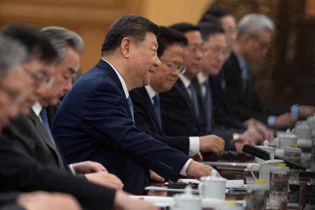 Chinese President Xi Jinping (C) attends a meeting with Uruguay's President Yamandu Orsi at the Great Hall of the People in Beijing on February 3, 2026. (Photo by JESSICA LEE / POOL / AFP)
