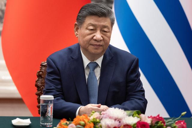 Chinese President Xi Jinping attends a signing ceremony with Uruguay's President Yamandu Orsi at the Great Hall of the People in Beijing on February 3, 2026. (Photo by JESSICA LEE / POOL / AFP)