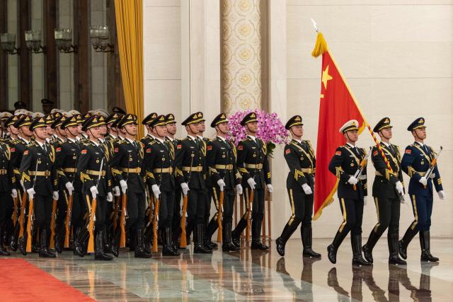Honour guards march during a welcome ceremony with Chinese President Xi Jinping and Uruguay's President Yamandu Orsi at the Great Hall of the People in Beijing on February 3, 2026. (Photo by JESSICA LEE / POOL / AFP)