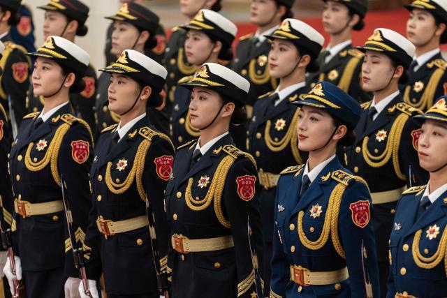 Guards stand during a welcome ceremony with Chinese President Xi Jinping and Uruguay's President Yamandu Orsi at the Great Hall of the People in Beijing on February 3, 2026. (Photo by JESSICA LEE / POOL / AFP)